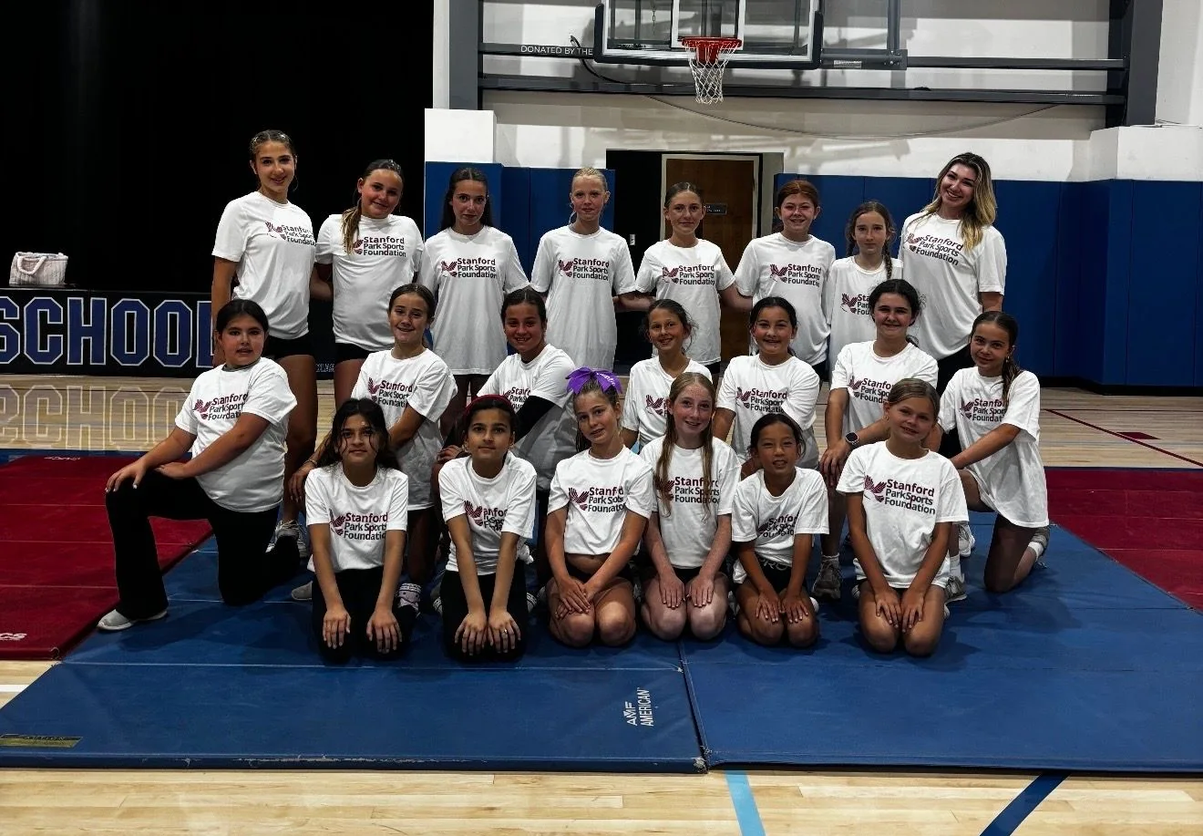 Summer camp cheerleading team in Stanford Park Sports Foundation shirts